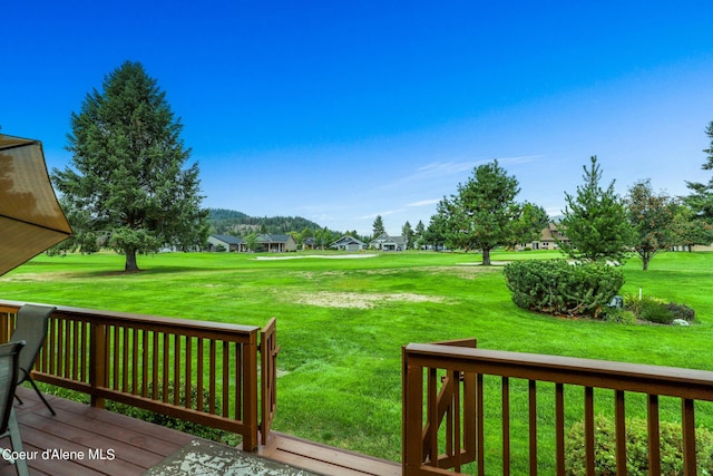 wooden deck with a yard