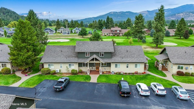 birds eye view of property with a mountain view