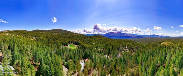 mountain view featuring a view of trees