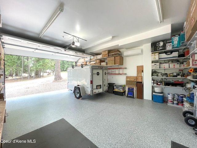 23 W Bay Wood Ln, Hope, ID 83836 - garage featuring a wall mounted air conditioner and a garage door opener