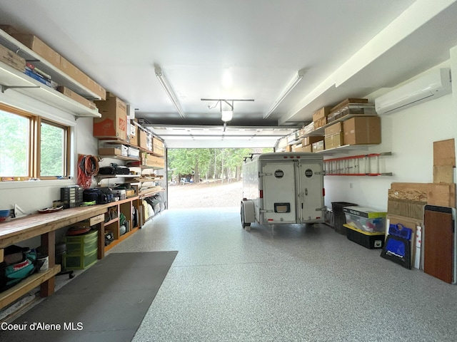 23 W Bay Wood Ln, Hope, ID 83836 - garage featuring a workshop area and a wall unit AC