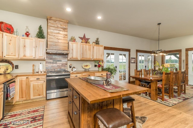 488 Fawn Ln, Bonners Ferry, ID 83805 - kitchen featuring gas stove, light wood-style floors, butcher block countertops, and light brown cabinetry