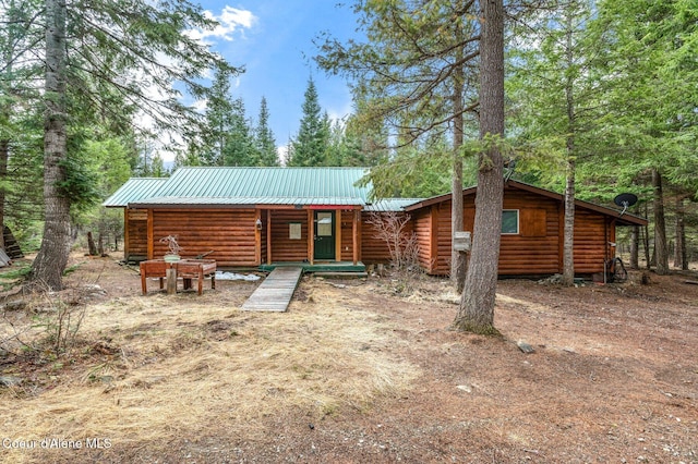 view of front of property with metal roof and log exterior