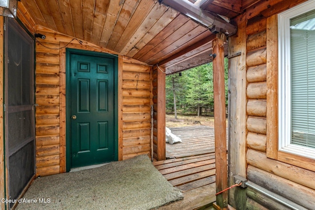 exterior space featuring vaulted ceiling and wooden ceiling