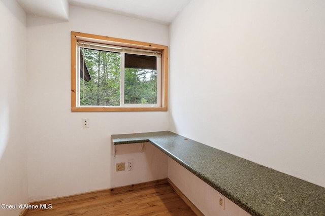 unfurnished office with light wood-style floors