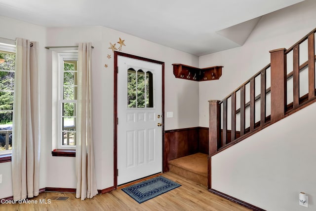 12854 E Hellroaring Rd, Athol, ID 83801 - foyer featuring light wood finished floors and stairway