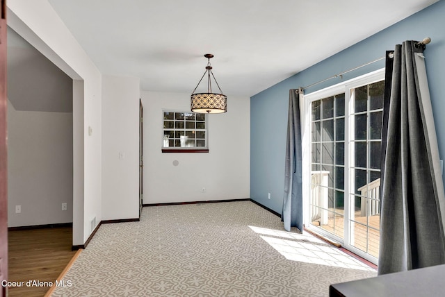 12854 E Hellroaring Rd, Athol, ID 83801 - unfurnished dining area featuring plenty of natural light, baseboards, and light colored carpet
