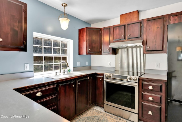 12854 E Hellroaring Rd, Athol, ID 83801 - kitchen with under cabinet range hood, stainless steel electric range, a sink, freestanding refrigerator, and decorative light fixtures