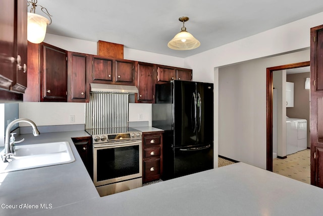 12854 E Hellroaring Rd, Athol, ID 83801 - kitchen featuring freestanding refrigerator, under cabinet range hood, a sink, stainless steel range with electric cooktop, and washing machine and clothes dryer