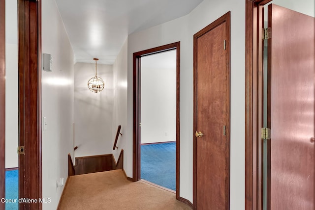 12854 E Hellroaring Rd, Athol, ID 83801 - hallway with an upstairs landing, carpet, and baseboards