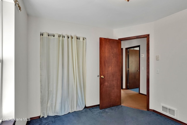 12854 E Hellroaring Rd, Athol, ID 83801 - spare room with carpet flooring and baseboards