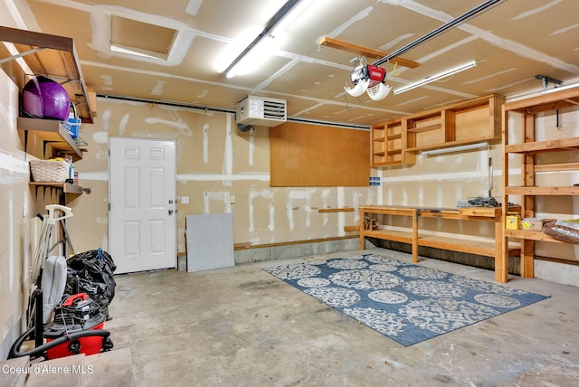 12854 E Hellroaring Rd, Athol, ID 83801 - garage featuring a heating unit and a garage door opener