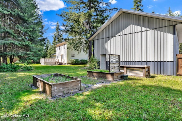 12854 E Hellroaring Rd, Athol, ID 83801 - back of house with a garden, a yard, and a deck