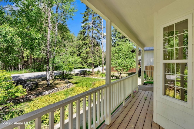 12854 E Hellroaring Rd, Athol, ID 83801 - wooden porch with view of scattered trees