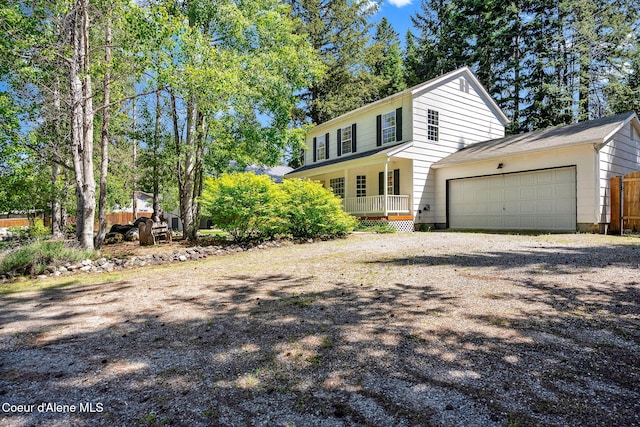 12854 E Hellroaring Rd, Athol, ID 83801 - view of front of home with a garage, a porch, and driveway