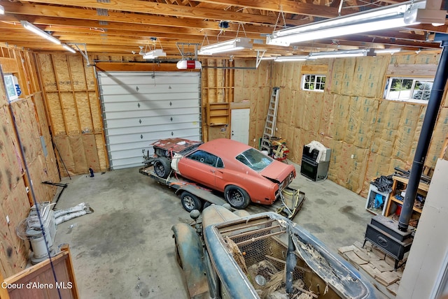 12854 E Hellroaring Rd, Athol, ID 83801 - garage featuring a wood stove
