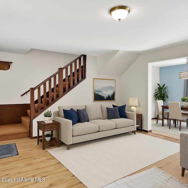 12854 E Hellroaring Rd, Athol, ID 83801 - living room featuring light wood finished floors and stairway