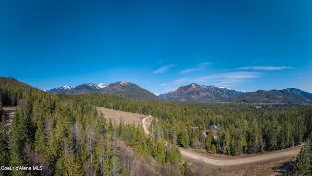 view of mountain feature with a view of trees