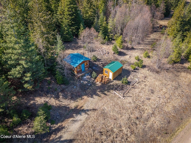 aerial view featuring a wooded view