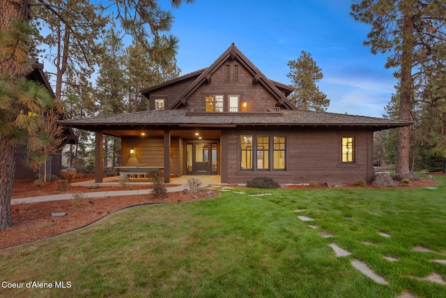 2623 E Old Barn Ct, Harrison, ID 83833 - view of front of house featuring a front lawn and a patio area