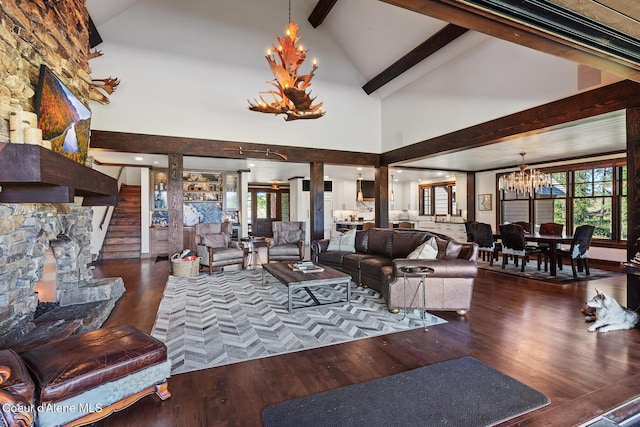 2623 E Old Barn Ct, Harrison, ID 83833 - living room featuring high vaulted ceiling, beam ceiling, a chandelier, and wood finished floors