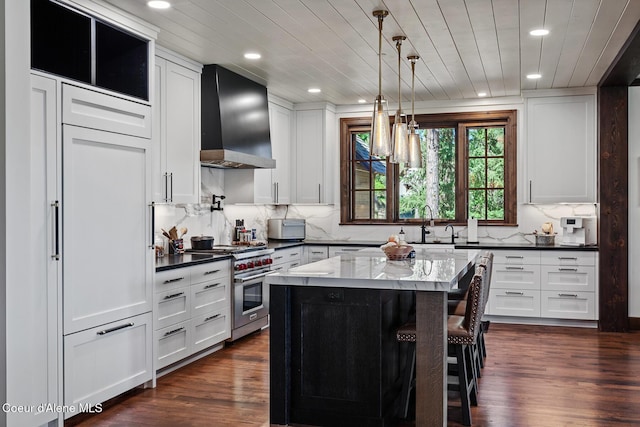 2623 E Old Barn Ct, Harrison, ID 83833 - kitchen featuring dark wood-style flooring, white cabinetry, stainless steel range, and custom range hood