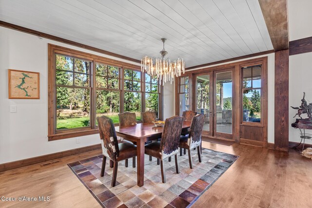 2623 E Old Barn Ct, Harrison, ID 83833 - dining space with visible vents, baseboards, wood finished floors, an inviting chandelier, and french doors