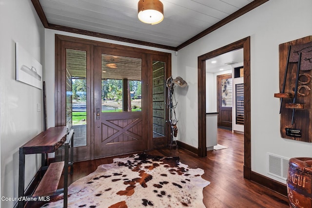 2623 E Old Barn Ct, Harrison, ID 83833 - entrance foyer featuring baseboards, visible vents, crown molding, and dark wood finished floors