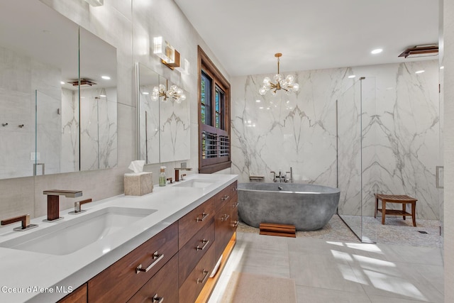 2623 E Old Barn Ct, Harrison, ID 83833 - bathroom featuring tile walls, a sink, a freestanding tub, and a marble finish shower