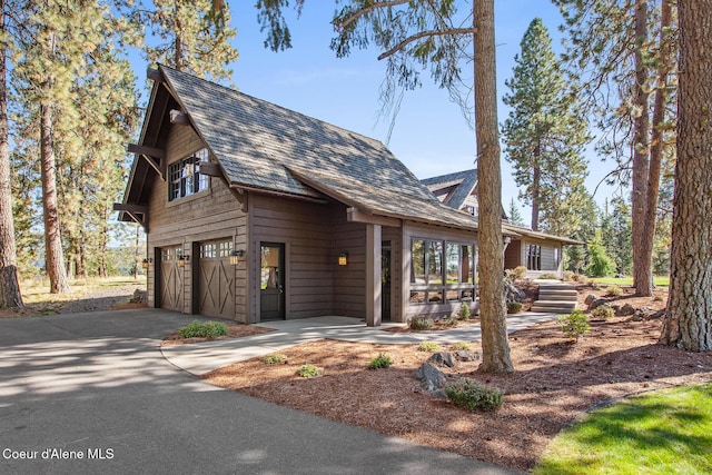 2623 E Old Barn Ct, Harrison, ID 83833 - view of front of property featuring an attached garage and concrete driveway