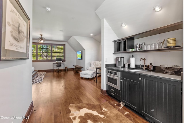 2623 E Old Barn Ct, Harrison, ID 83833 - bar featuring oven, wood finished floors, a sink, indoor wet bar, and vaulted ceiling