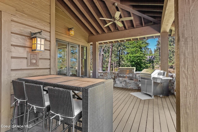 2623 E Old Barn Ct, Harrison, ID 83833 - wooden terrace with french doors, an outdoor kitchen, a ceiling fan, and grilling area