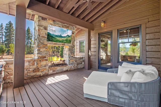 2623 E Old Barn Ct, Harrison, ID 83833 - wooden deck featuring an outdoor stone fireplace