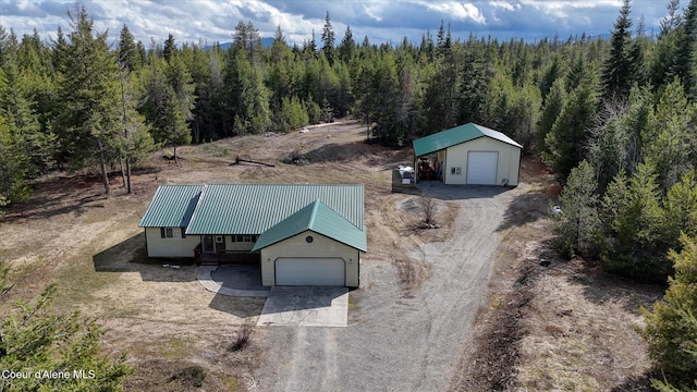 aerial view featuring a wooded view