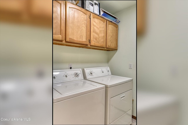 laundry room with cabinet space and washer and clothes dryer