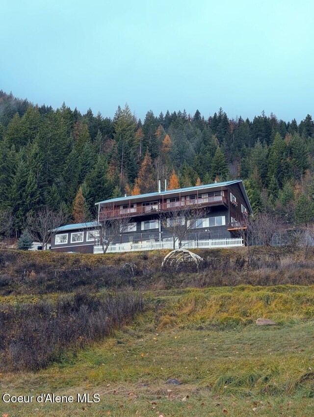 surrounding community with a forest view