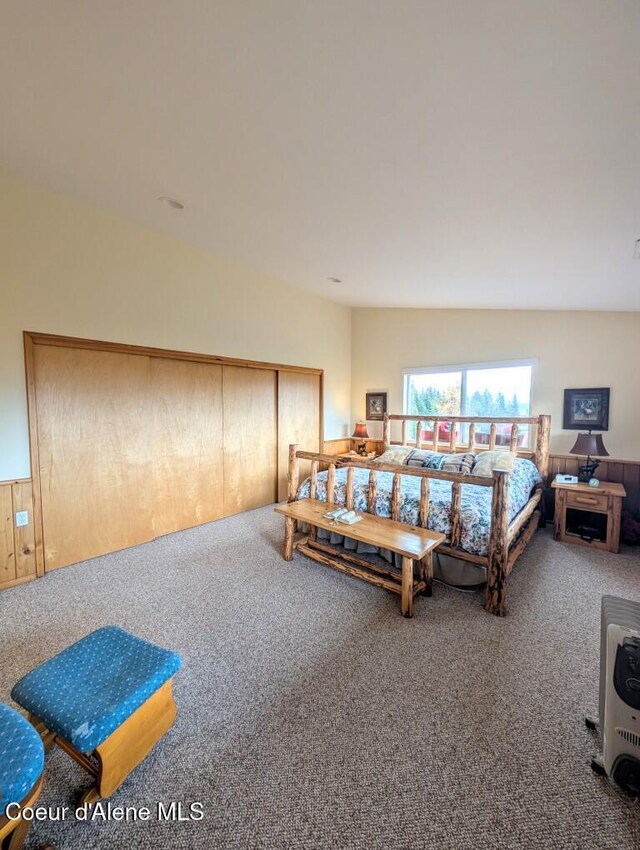 carpeted bedroom featuring heating unit