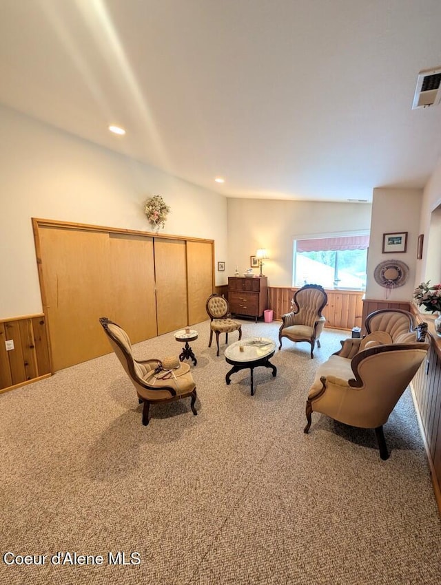 living area with carpet floors, recessed lighting, and visible vents