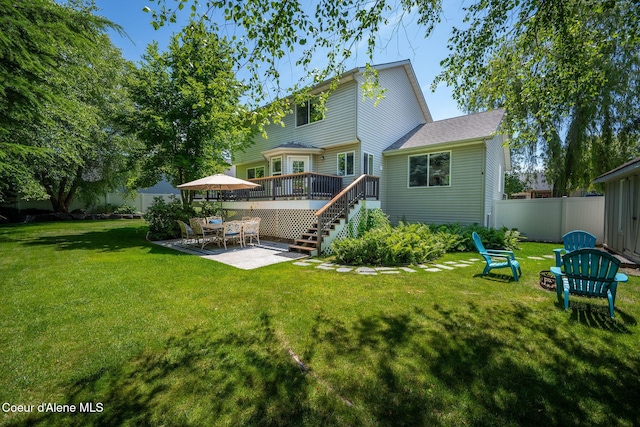 687 E Round Up Cir, Hayden, ID 83835 - rear view of property with stairs, a wooden deck, and a patio area