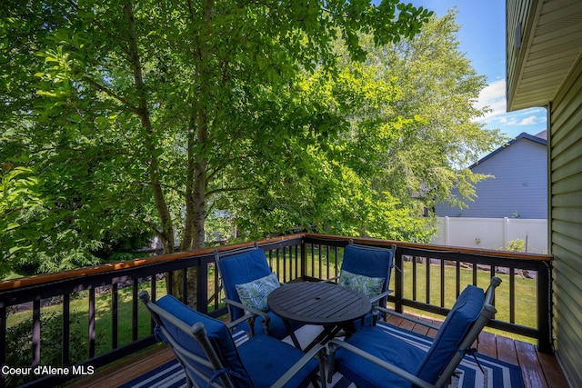 687 E Round Up Cir, Hayden, ID 83835 - wooden deck with outdoor dining area