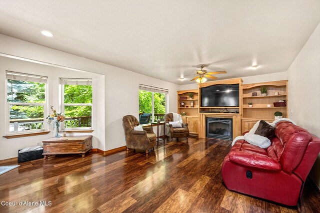687 E Round Up Cir, Hayden, ID 83835 - living room featuring a glass covered fireplace, wood finished floors, a ceiling fan, and recessed lighting