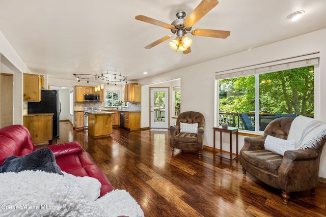 687 E Round Up Cir, Hayden, ID 83835 - living area with dark wood finished floors, ceiling fan, and recessed lighting