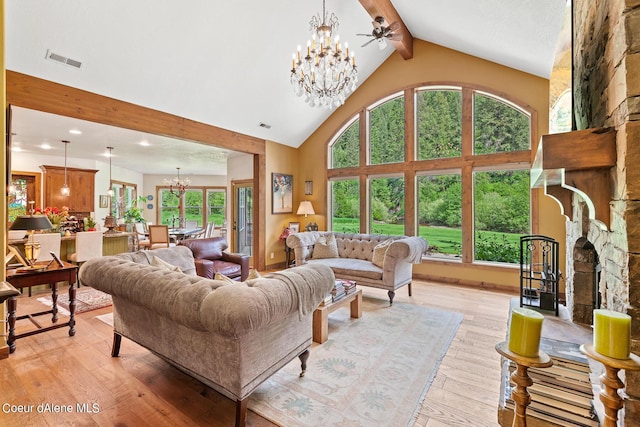 1990 S Gateway Ranch Rd, Coeur Dalene, ID 83814 - living room with visible vents, a chandelier, beam ceiling, light wood finished floors, and high vaulted ceiling