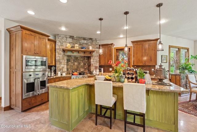 1990 S Gateway Ranch Rd, Coeur Dalene, ID 83814 - kitchen featuring stainless steel appliances, a wealth of natural light, and decorative light fixtures