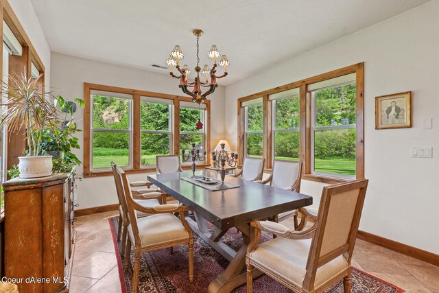 1990 S Gateway Ranch Rd, Coeur Dalene, ID 83814 - dining area featuring visible vents, baseboards, and an inviting chandelier