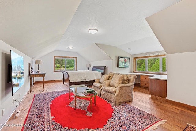 1990 S Gateway Ranch Rd, Coeur Dalene, ID 83814 - bedroom with light wood-style floors, baseboards, and lofted ceiling