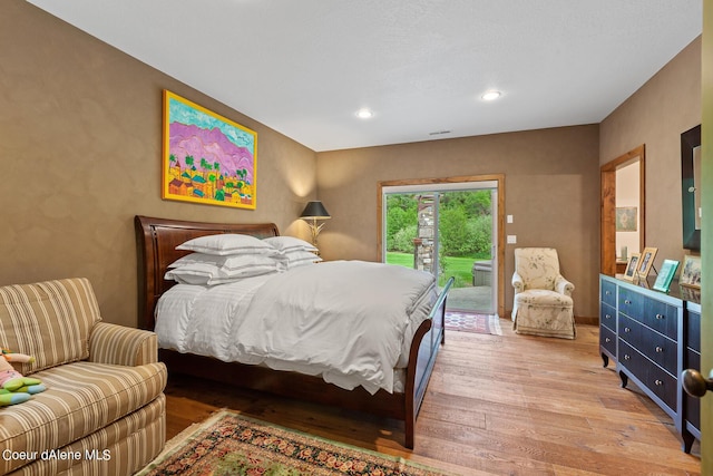 1990 S Gateway Ranch Rd, Coeur Dalene, ID 83814 - bedroom featuring access to outside, wood finished floors, visible vents, and recessed lighting