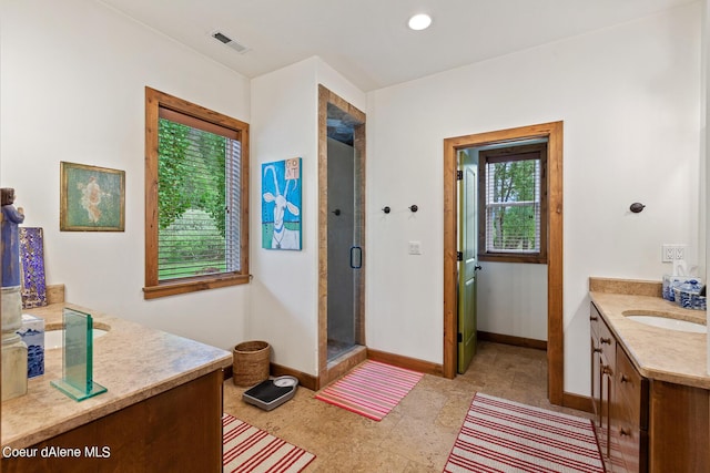1990 S Gateway Ranch Rd, Coeur Dalene, ID 83814 - full bath with a shower stall, vanity, baseboards, and visible vents