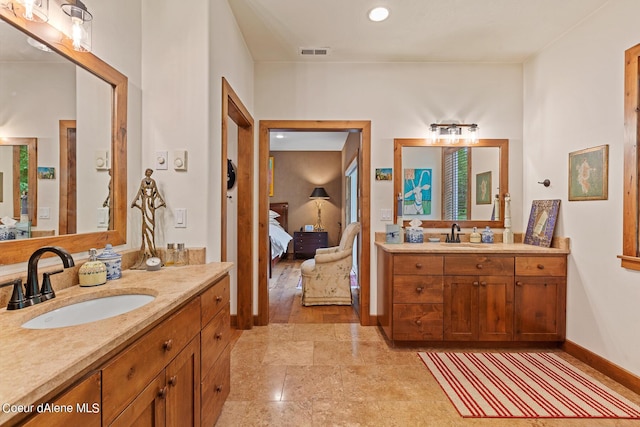 1990 S Gateway Ranch Rd, Coeur Dalene, ID 83814 - ensuite bathroom featuring two vanities, a sink, visible vents, and connected bathroom
