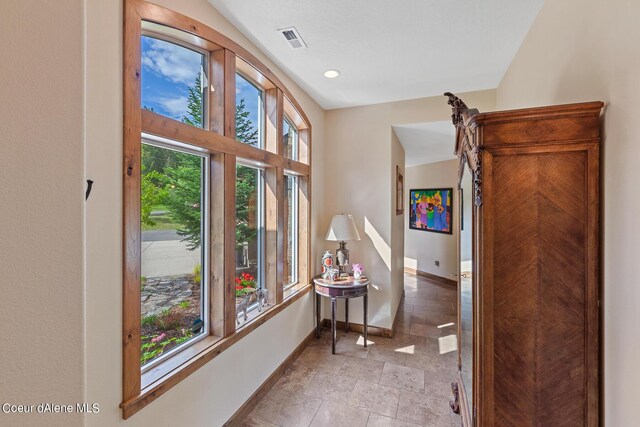 1990 S Gateway Ranch Rd, Coeur Dalene, ID 83814 - hall featuring recessed lighting, baseboards, visible vents, and a wealth of natural light